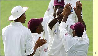 Pedro Collins congratulated by team-mates