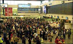 Commuters wait in Euston