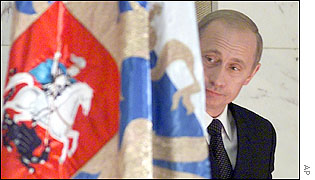 Russian President Vladimir Putin enters the news conference at the Kremlin