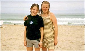 Milly Dowler (left) and her sister Gemma on holiday