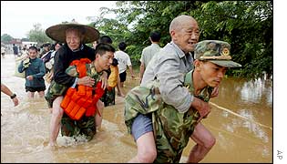 Rescuers carry elderly residents to safety, Xingan