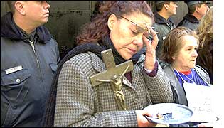 A demonstrator begs for money in Argentina