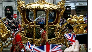 Flag waving as the state Gold Coach passes in London