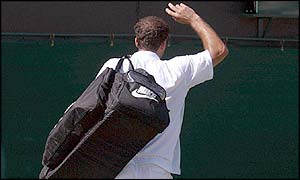Pete Samnpras waves to the crowd after his shock five-set defeat to George Bastl 