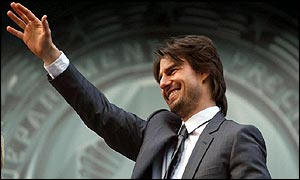 Tom Cruise waves to fans