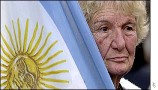 A woman protester and the Argentine flag