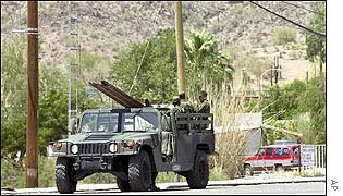Mexican soldiers pass through the Mexican town of Sonoyta near the US border