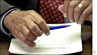 Michael Oxley of the House of Representatives signs a subpoena ordering testimony from WorldCom bosses