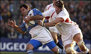Argentina hooker Federico Mendez tries to escape the clutches of England lock Ben Kay