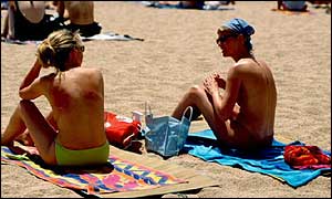 Women sunbathing on the beach