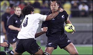 Nicky Little (left) tackles New Zealand's Tana Umaga
