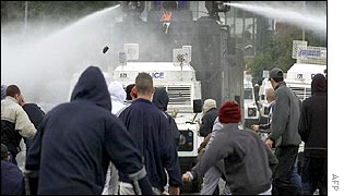 Police firing water cannon in the street