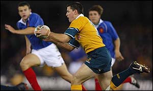 Matthew Burke in action against France