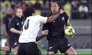 Tana Umaga (right) is tackled during New Zealand's 68-18 win over Fiji.
