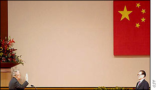 Hong Kong Chief Executive Tung Chee-hwa (L) is sworn in by Chinese President Jiang Zemin for a second five year term