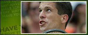 Britain's Tim Henman disputes a call with the umpire