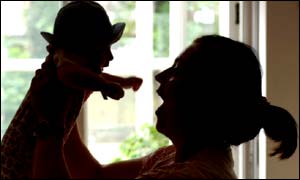Woman holds child