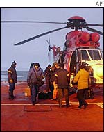 11 Russian scientists disembarking from an Oryx helicopter on the landing deck of the S A Agulhas  - 27 June