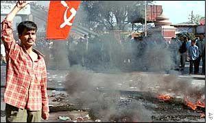 Leftist demonstrator flies the flag