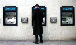 A customer using an ATM machine