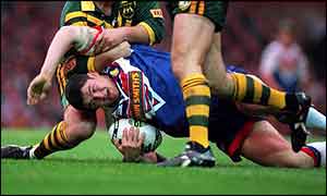 Great Britain's Andy Farrell gets hauled to earth in 1994