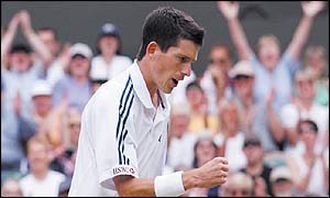 Tim Henman pumps his first on his way to victory over Andre Sa