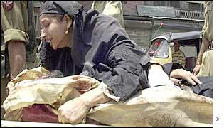 Wife of pro-India Kashmiri leader Anwar Hossain Baba grieves after he was shot in Srinagar