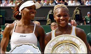 Venus and Serena Williams with their trophies