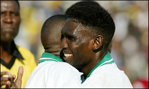 Zambia's Elijah Tana congratulates goalscorer Robson Kilambe