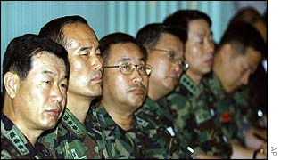 South Korean military officers listen to briefing on the deadly naval clash with the North 