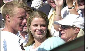 Hewitt (left) talks with his mother (right) after winning the Wimbledon title
