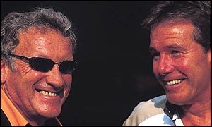 Arrows boss Tom Walkinshaw chats to Craig Pollock at the Hungarian Grand Prix in 2001