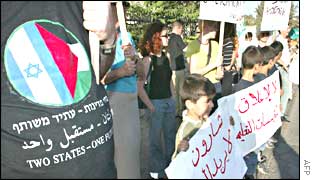 Israelis and Palestinians demonstrate outside Al Quds University's administrative offices on Tuesday