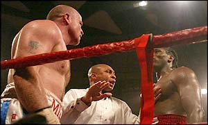 Audley HArrison (right) and Dominic Negus are separated by the referee during their hot-tempered  clash