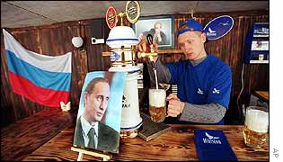 Barman Yevgeny Tochilov pours beer in Putin cafe
