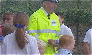 George Smith with school children