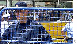 Bosnian  Serb policeman at mourners' coach