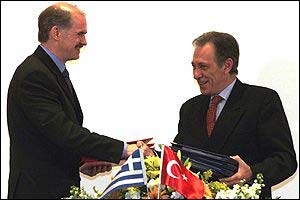 Greek Foreign Minister George Papandreou (L) and Ismail Cem 