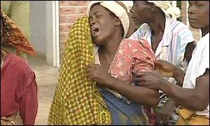 A woman struck by grief in Malawi, on hearing her baby has died