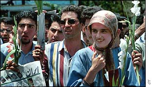 Iranian university students hold flowers as they stage a peaceful - September 2000