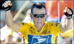 Lance Armstrong celebrates at the end of stage 12
