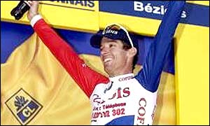 David Millar celebrates on the winner's podium