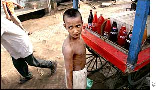 A child carries water in New Delhi
