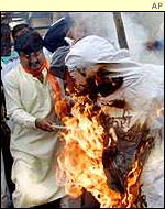 Effigies burn in Delhi