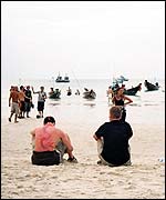 Clubbers on beach