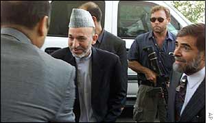 Hamid Karzai with US special forces as bodyguards
