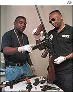 Policemen showing captured firearms