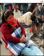 Woman sleeping with her machete in her hand