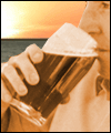 Man with pint of beer in the sun