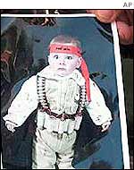 A picture of a child with an ammunition belt and a Hamas head band found in a West Bank house  in June